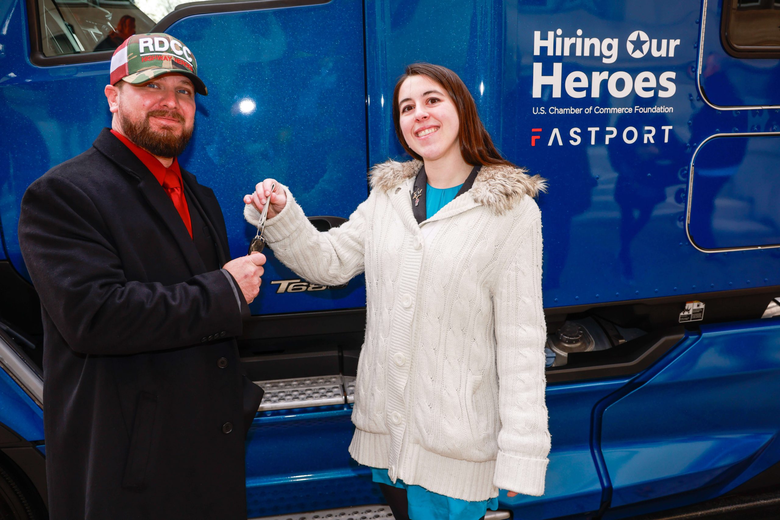 image of Cory Troxell receiving keys to his brand new Kenworth T680 truck.