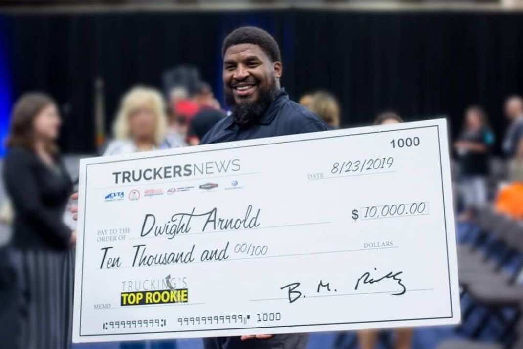 Image of Dwight Arnold holding large check