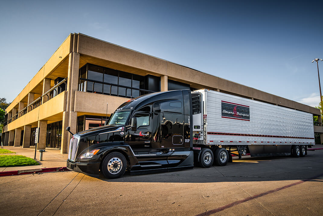 Image of Stevens Transport truck parked in front of building