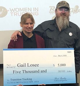 image of Gail Losee with Transition Trucking check
